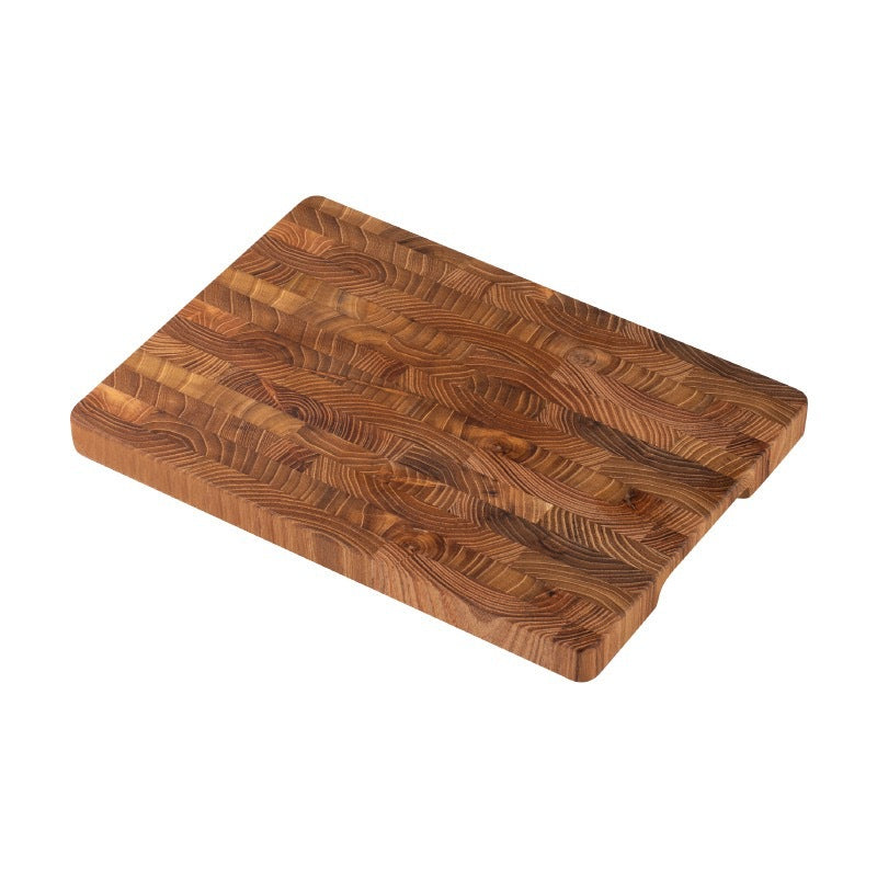 End-grain teak cutting board showing the recessed grip along the long side