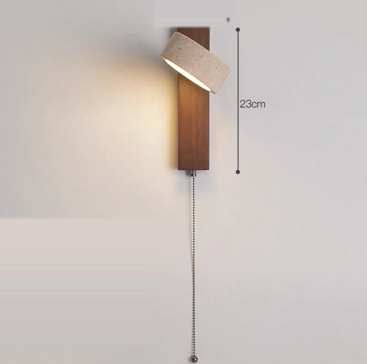 Walnut wall sconce with a pull-cord switch, shade angled