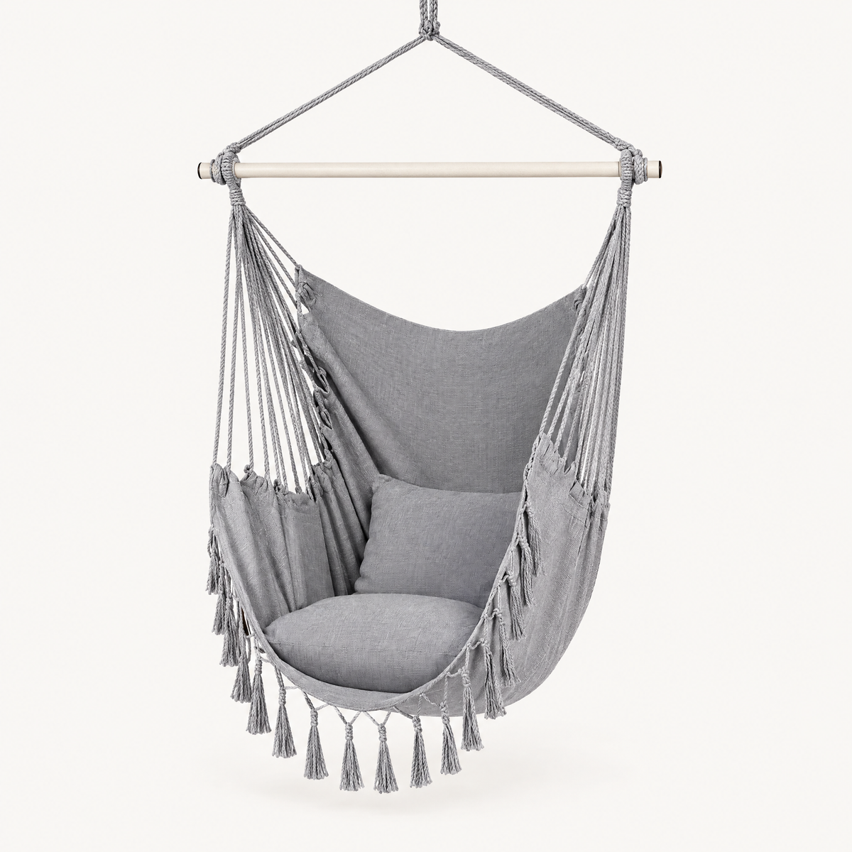 Canvas hanging chair shown against a plain warm off-white background